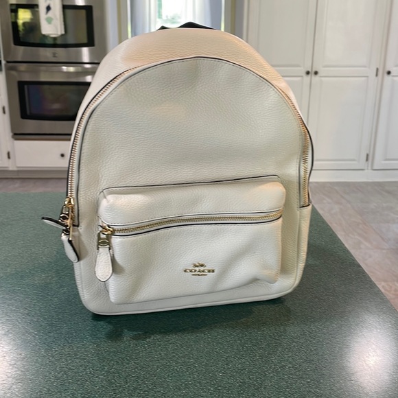 Coach Handbags - backpack is in excellent condition. Carried 2 times, one tiny flaw as pictured
